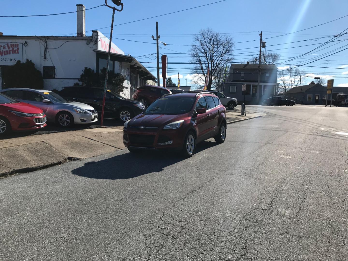 2015 Red /Gray Ford Escape SE (1FMCU9GX6FU) with an 1.6 V4 engine, Automatic transmission, located at 577 Chester Pike, Prospect Park, PA, 19076, (610) 237-1015, 39.886154, -75.302338 - Photo#1